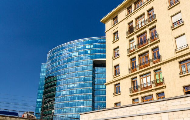 Low angle view of modern building against blue sky