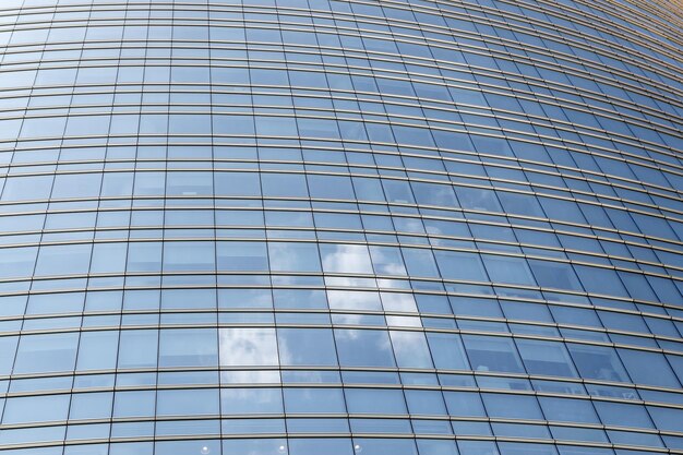 Low angle view of modern building against blue sky