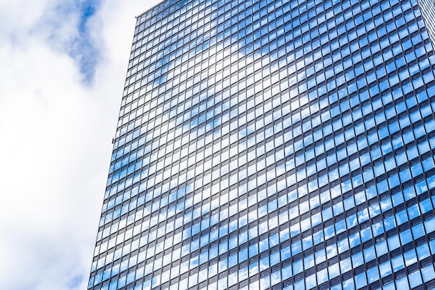 low angle view of modern building against cloudy sky