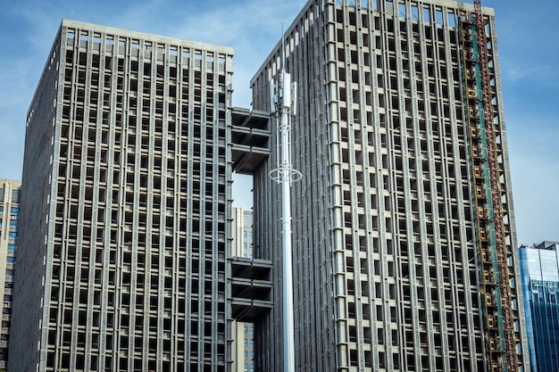 Low angle view of modern buildings against blue sky