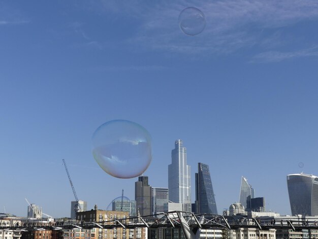 Low angle view of modern buildings against blue sky