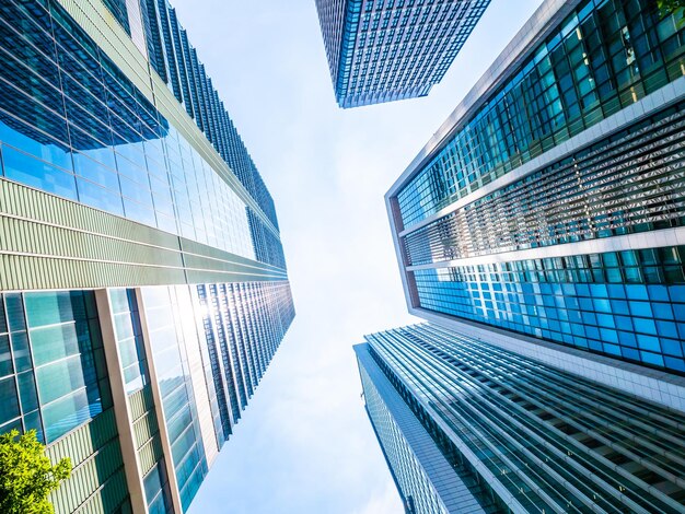 Low angle view of modern buildings against blue sky