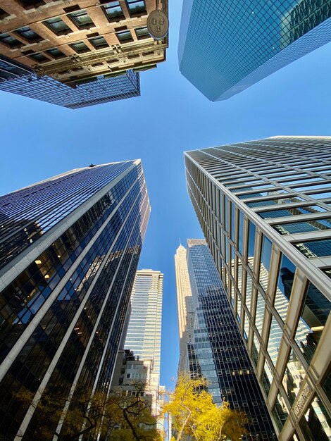 Low angle view of modern buildings against clear sky