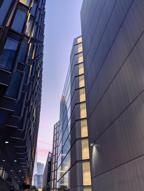 Low angle view of modern buildings against clear sky