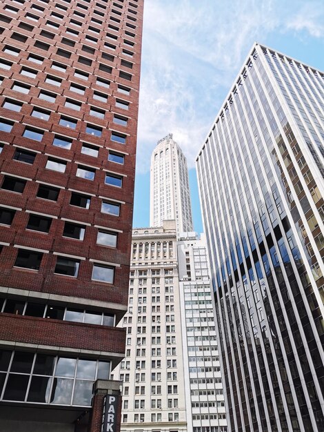 Low angle view of modern buildings against sky in city