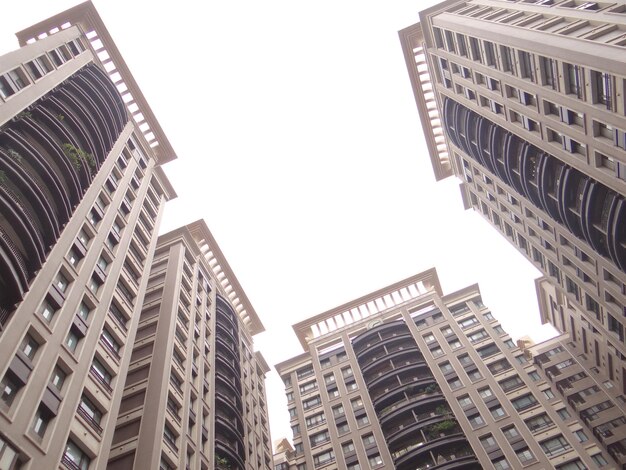 Low angle view of modern buildings against sky