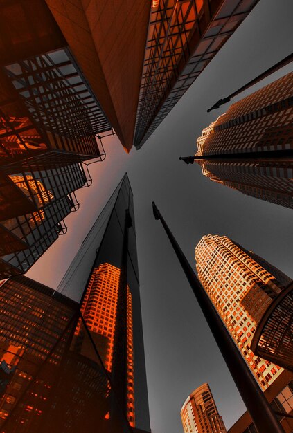 Photo low angle view of modern buildings in city against sky