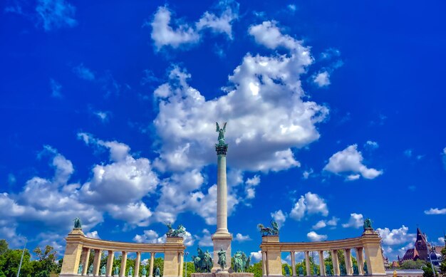 Low angle view of monument against cloudy sky