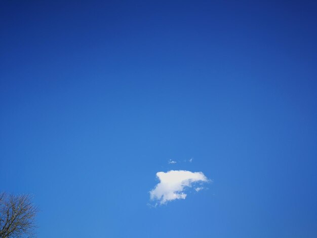 Low angle view of moon in blue sky