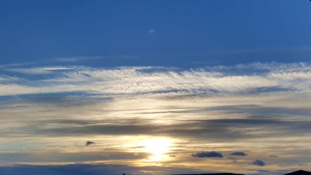 Low angle view of moon at sunset