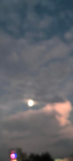 Low angle view of moon at sunset