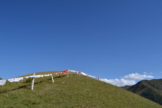 Low angle view of mountain against clear blue sky