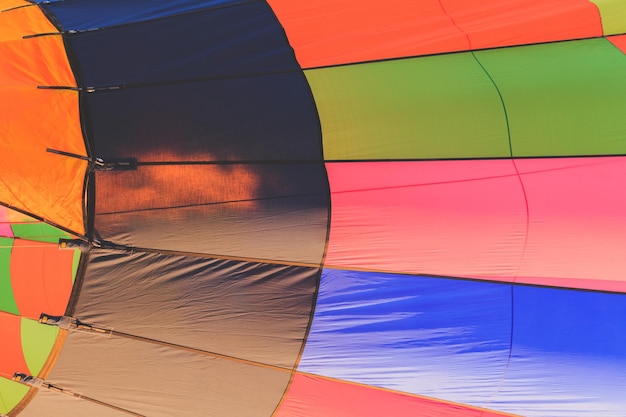 Low angle view of multi colored umbrellas against sky