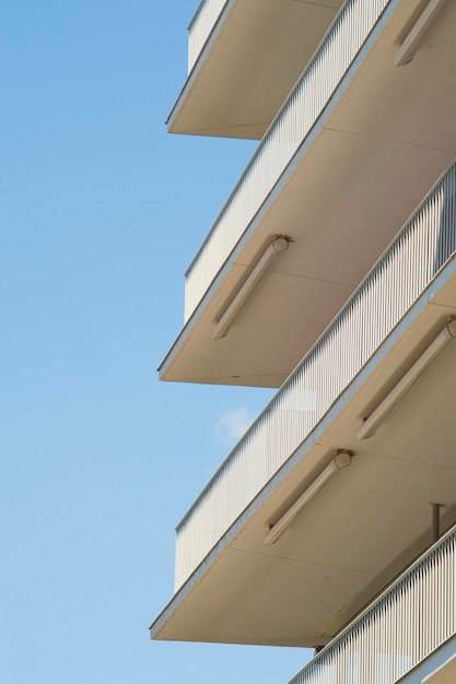 Low angle view of office building against blue sky