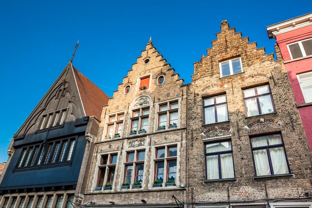 Low angle view of old building against blue sky