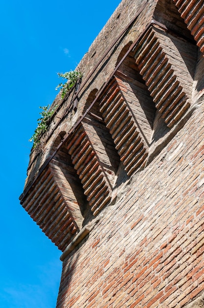Low angle view of old building against blue sky