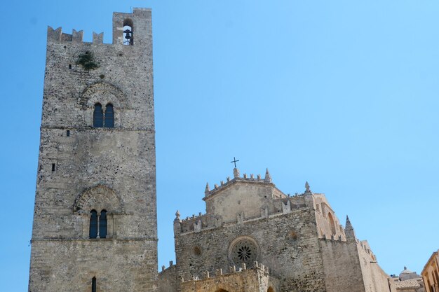 Low angle view of old building against clear blue sky