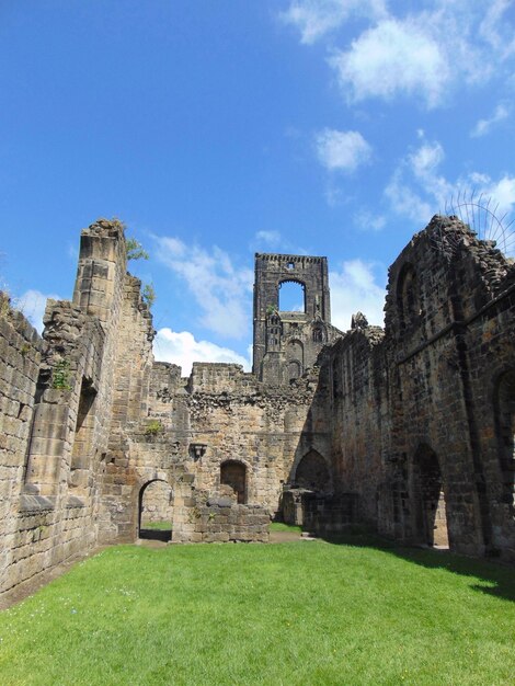 Low angle view of old ruin building against sky