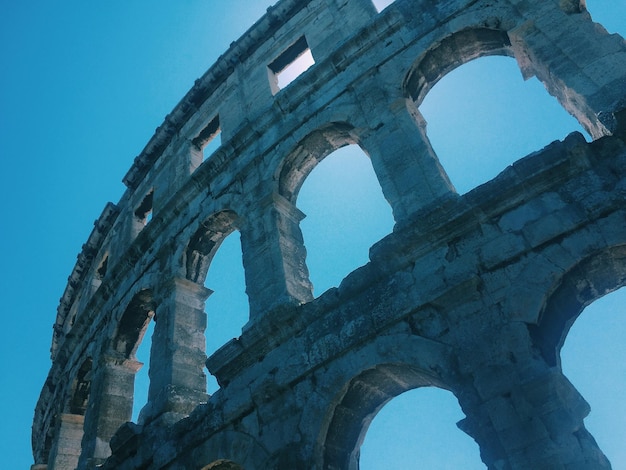 Low angle view of old ruins against clear sky