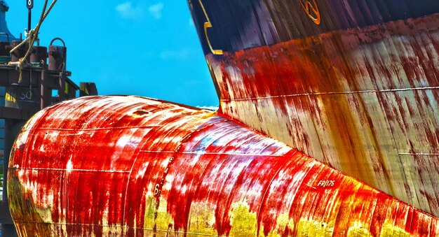 Low angle view of old ship against blue sky