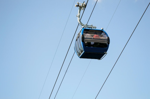 low angle view of overhead cable car against clear blue sky