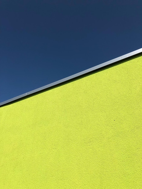 Low angle view of painted building in city