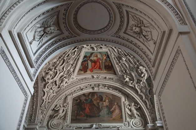 Low angle view of paintings on salzburg cathedral ceiling