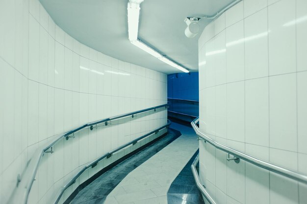 Photo low angle view of people walking on escalator