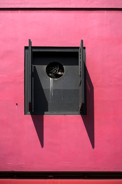 Photo low angle view of pink window on building