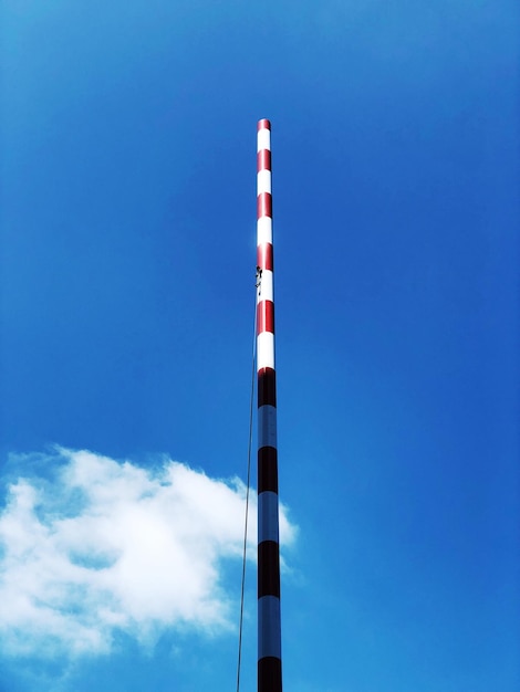 Low angle view of pole against blue sky