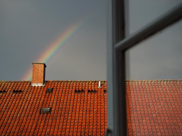 Low angle view of rainbow over building