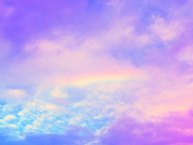 Low angle view of rainbow in sky during sunset