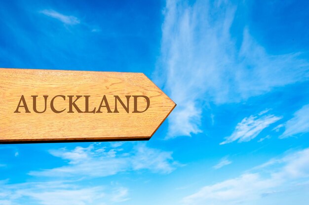 Low angle view of road sign against blue sky