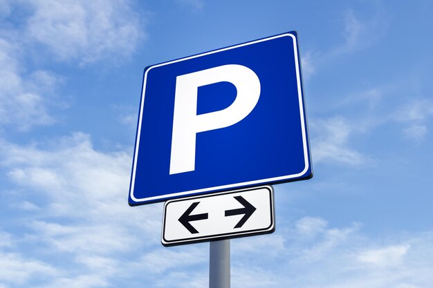 Low angle view of road sign against sky