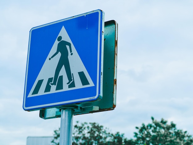 Low angle view of road sign against sky