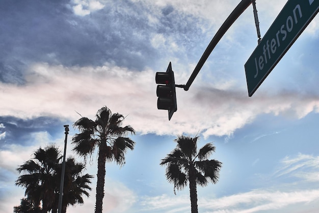 Low angle view of road sign against sky