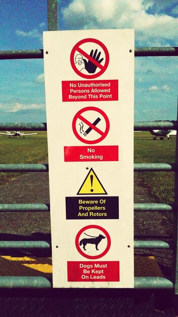 Low angle view of road sign against sky