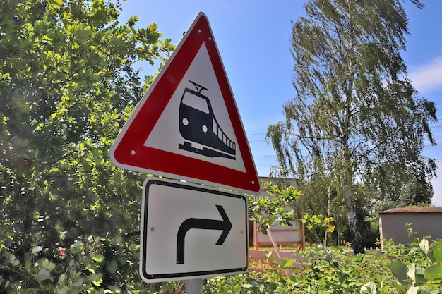 Low angle view of road sign against trees