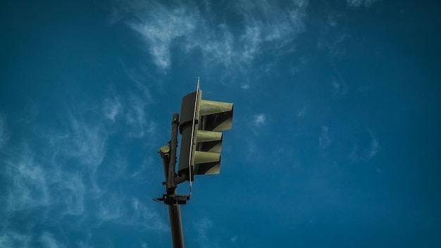 low angle view of road signal against sky