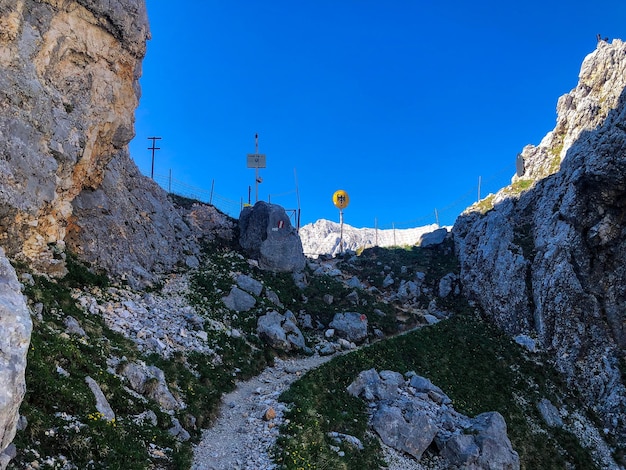 Low angle view of rock amidst buildings against sky