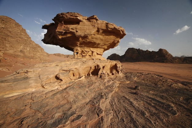 low angle view of rock formation against sky during sunny day