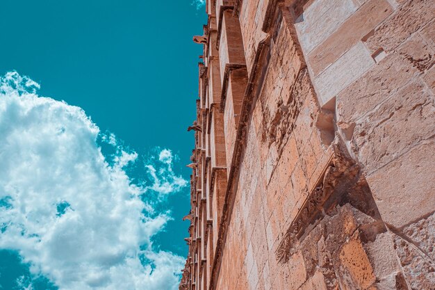 Low angle view of rock formation against sky