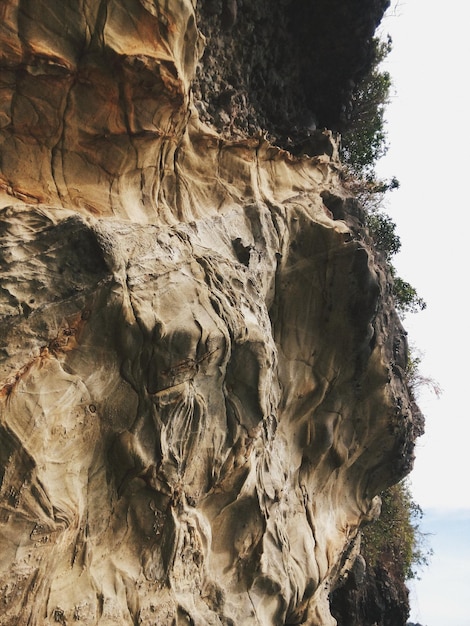 Low angle view of rock formation against sky