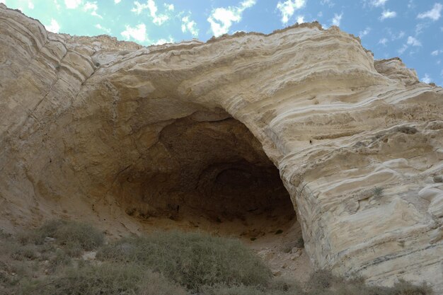 Low angle view of rock formation against sky