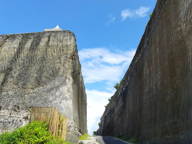 Low angle view of rock formation against sky