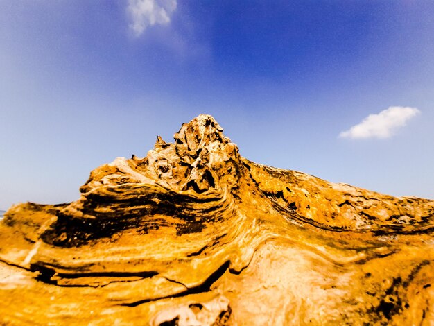 Low angle view of rock formation against sky