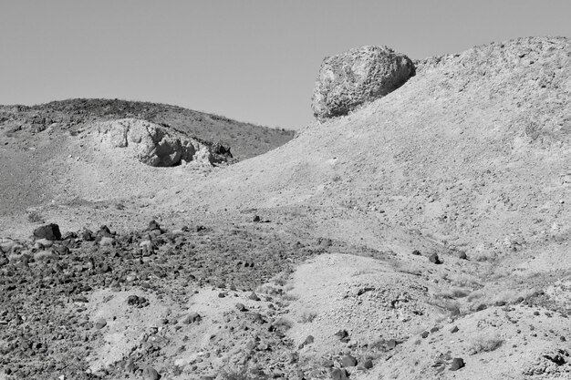 low angle view of rock formations against sky