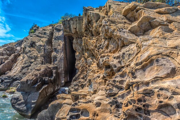 Low angle view of rock formations against sky