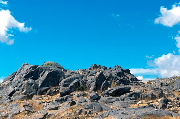 Low angle view of rock formations against sky