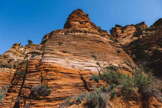 Low angle view of rock formations against sky